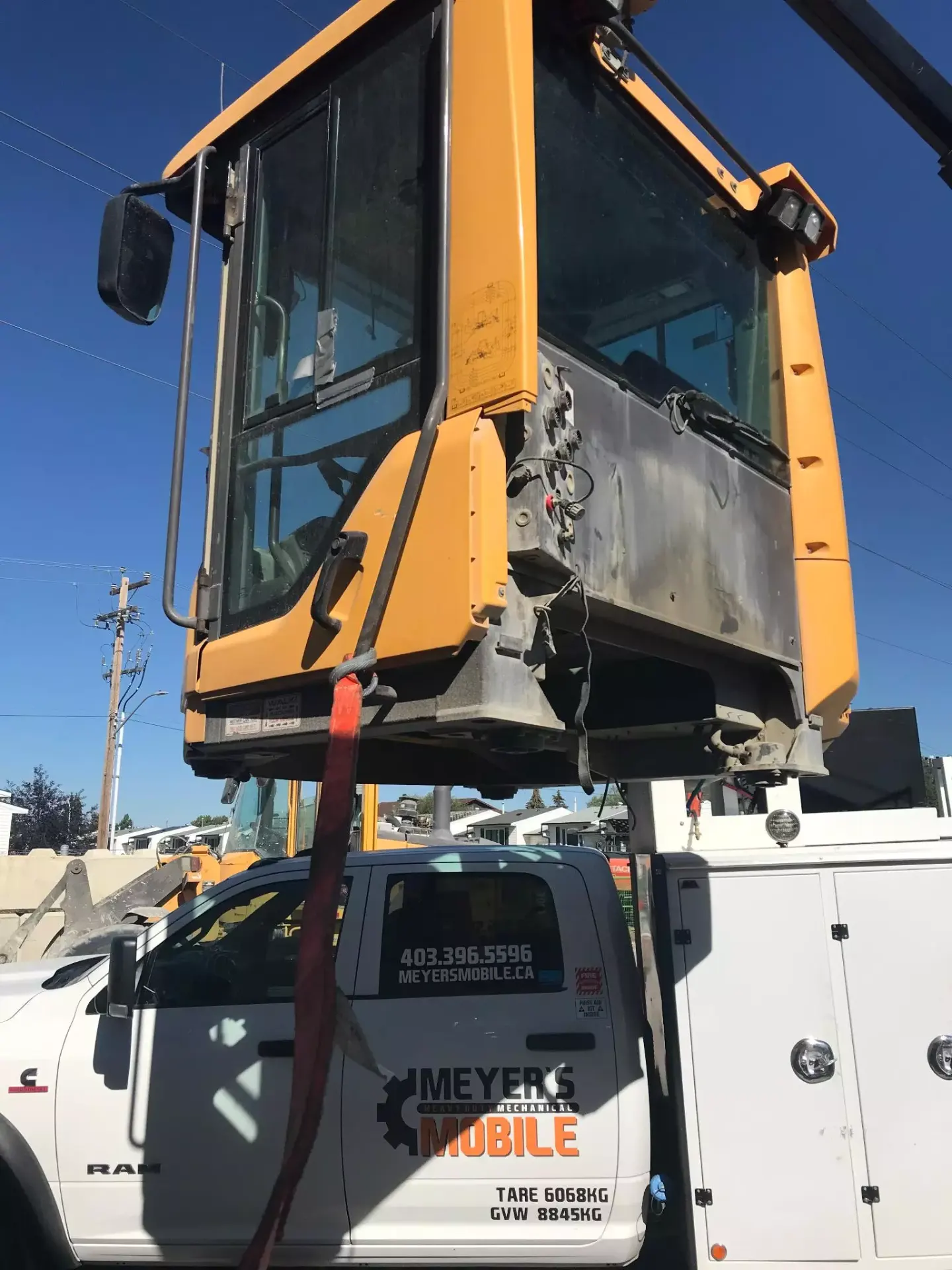 Loader cab removal with tag line